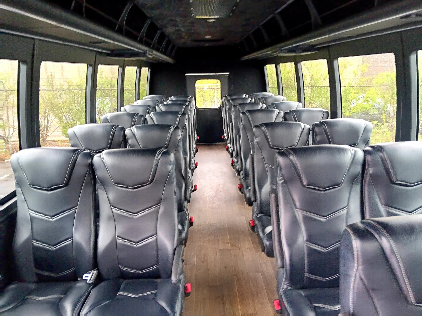 Motor coach at corporate shuttle pickup — group transportation